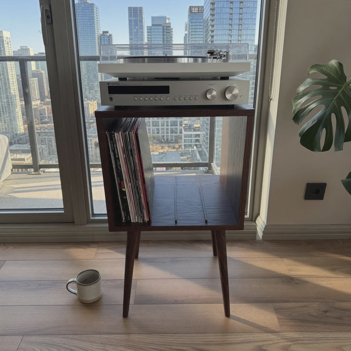 Wooden record player stand with vinyl storage and audio equipment